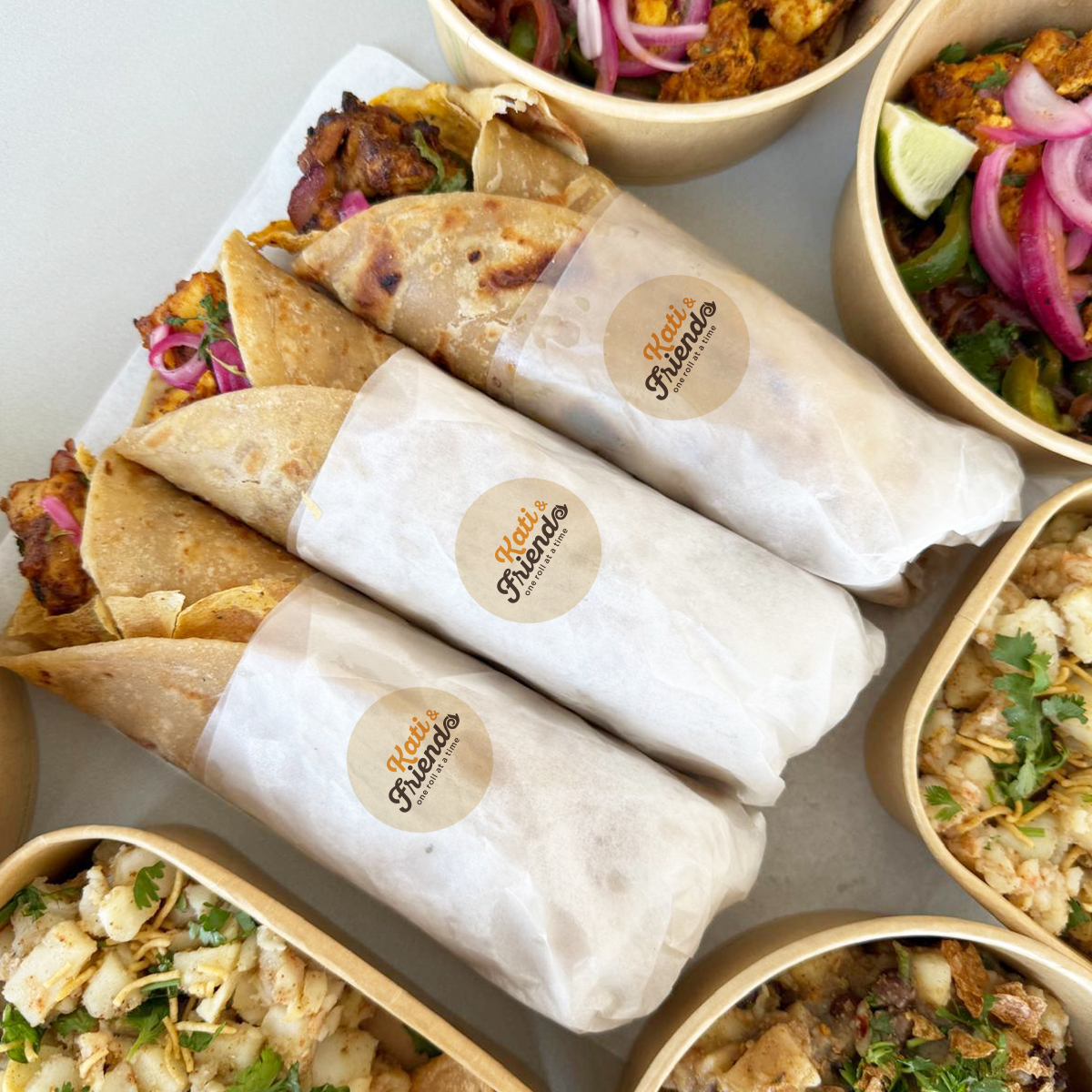 Kati rolls with Kati and Friends stickers, chaat and bowls